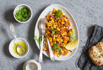 Baked pumpkin and corn salad. Healthy vegetarian food. Top view © okkijan2010
