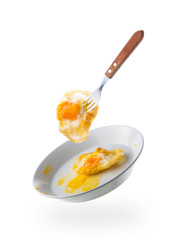 fried eggs with fork on white plate isolated white background,fl
