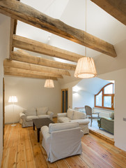 Wooden design. Apartment with wooden floors, ceilings and furnit
