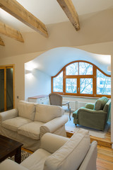 Wooden design. Apartment with wooden floors, ceilings and furnit