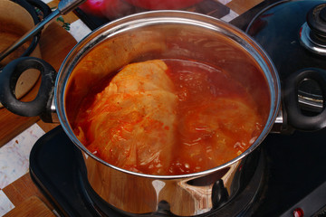 Stuffed cabbage rolls cooking in a pot