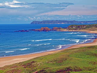 White Park Bay vista on the County Antrim coast of Northern Ireland near Ballintoy, with Rathlin Island in the background
