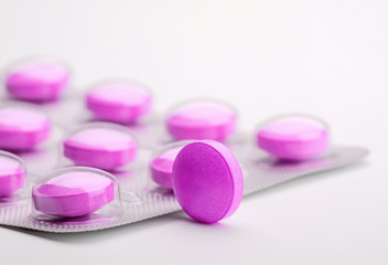 Obraz na płótnie Canvas small purple pill box on a white background