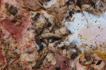 Pizza with egg, ham. In square with fountain.