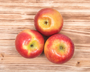 Naklejka na ściany i meble Ripe organic kanzi apple on vintage wooden tray