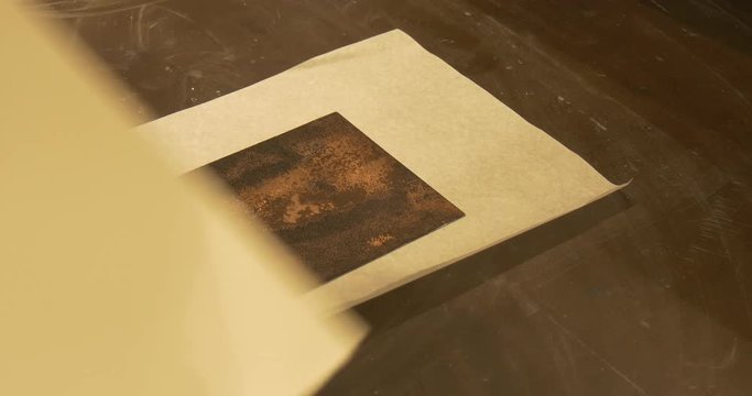 the Process of Producing an Engraving Picture, When a Bulging Relief Metal Bar is Covered With a Thin and a Thick Sheets of Paper, Placed on Copper Plate