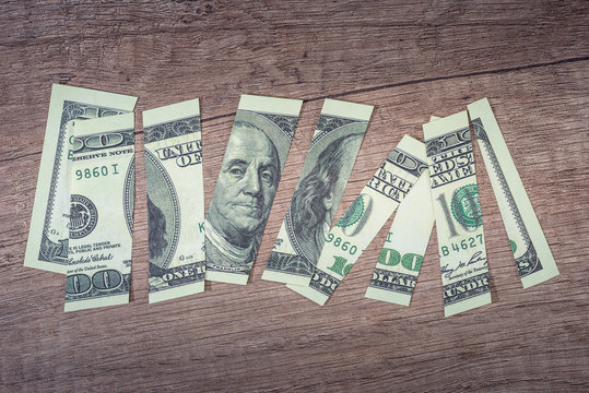 torn 100 us dollar Franklin close up