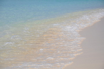 Fototapeta na wymiar Ocean water coming to beach in Cayman Island