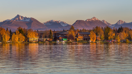 Naklejka premium Warm colors of sunset at Spenard Lake in Anchorage. USA