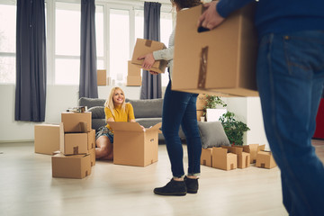 Group of friends moving into new apartment