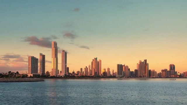 pan across panama city skyline at sunset