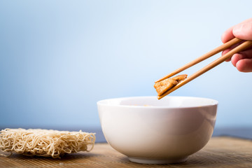 Dried Chinese noodles with meat in the dish