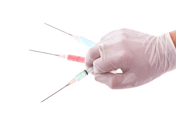 Hand mit drei Spritzen