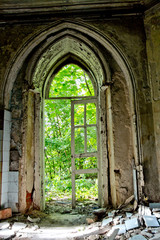 Fototapeta na wymiar Old rotten doorway of an abandoned mansion of Khvostov in gothic style 