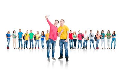 Obraz premium Large group of teenage students isolated on white background. Many different people standing together. School, education, college, university concept.