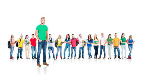 Large group of teenage students isolated on white background. Many different people standing together. School, education, college, university concept.