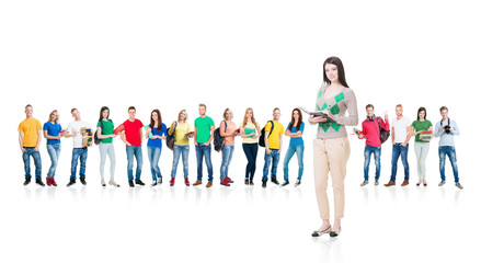Obraz premium Large group of teenage students isolated on white background. Many different people standing together. School, education, college, university concept.