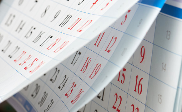 Flipping of calendar sheets with black and red numbers