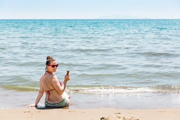 Girl at the beach of the Tyrrhenian sea in the Italian region Tu
