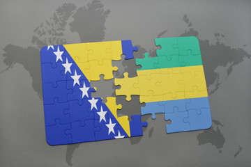 puzzle with the national flag of bosnia and herzegovina and gabon on a world map