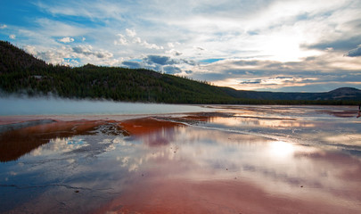 Grand Prismatic Spring under sunset cloudscape in the Midway Geyser Basin in Yellowstone National Park in Wyoming USA