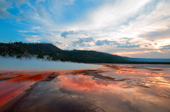 Grand Prismatic Spring under sunset cloudscape in the Midway Geyser Basin in Yellowstone National Park in Wyoming USA