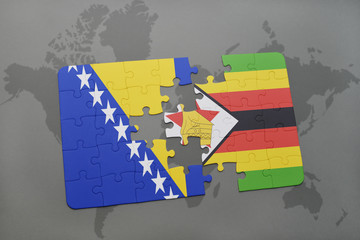 puzzle with the national flag of bosnia and herzegovina and zimbabwe on a world map