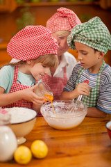 Grandmother with young kids In Kitchen