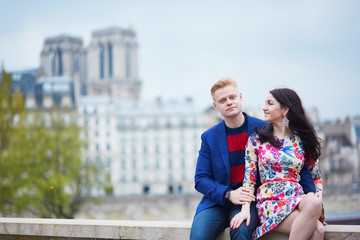 Romantic couple in Paris near the Seine