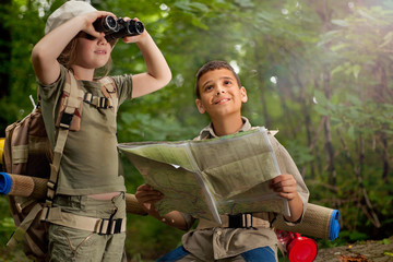 boys on camping trip in the forest exploring