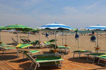 sun umbrellas and deck chairs on the beach resort