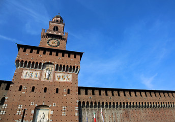 Fototapeta premium big clock tower of Castle called Castello Sforzesco in Milan Ita