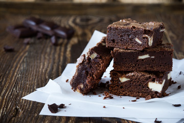 Chocolate brownies with cream cheese on baking paper
