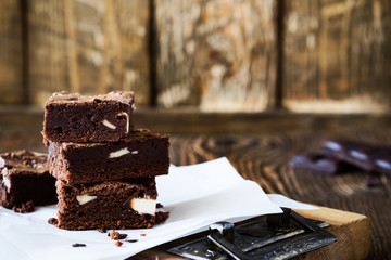 Chocolate brownies with cream cheese on baking paper