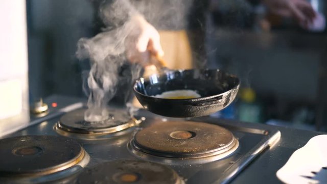 Chief beating egg for frying in 4K