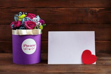Beautiful purple flowers in a box on a wooden background. Concep
