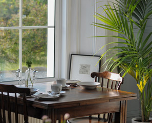 Table at the window set for a meal