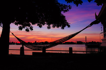 sunset with hammock in the shadow