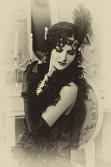 Beautiful  woman, portrait in retro  style .  Old photo. Vintage toning.