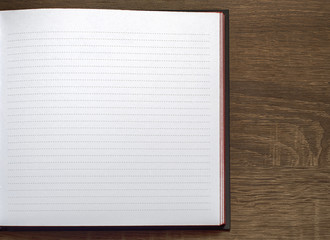 new notebook on the brown wooden table