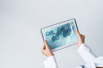 Close of female doctor hands working with tablet pc computer