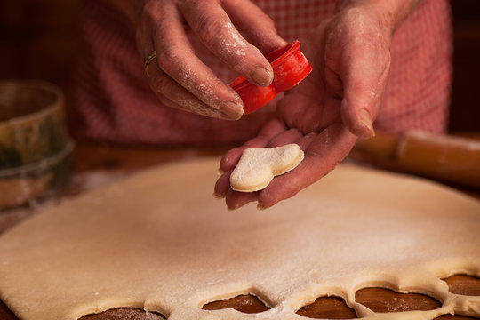 hands of senior woman preparing delicious cookies