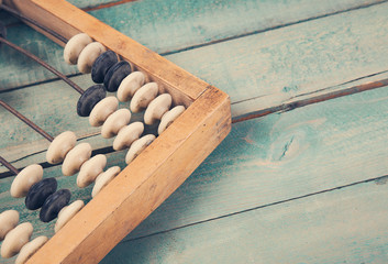 Old vintage abacus on wooden background