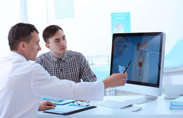 Medical concept. Doctor showing results of urology diagnostic on computer monitor