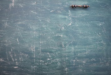 Hunter green #2 background on wood with handle and copy space.