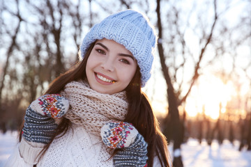 Beautiful young woman outdoors on winter day