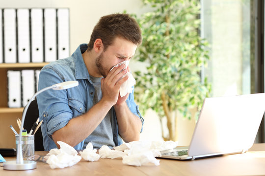 Entrepreneur blowing with a wipe at office