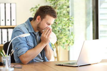 Ill entrepreneur sneezing at office