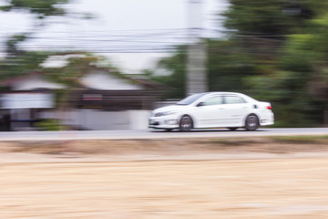 Fototapeta na wymiar Car panning speed on road, Thailand asia