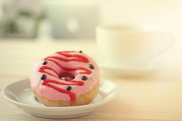 Delicious donuts on wooden table  closeup